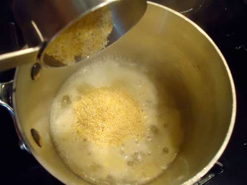 add the grits to the hot liquid