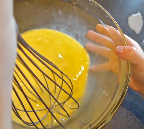 laurel whisking eggs