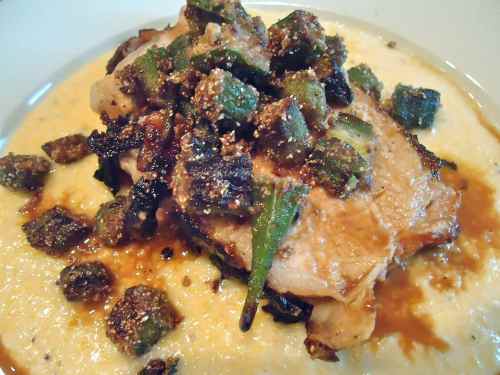 pork and fried okra on a pool of grits