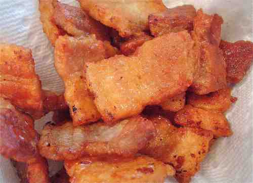 Drain the cooked pork belly on paper towels. You can top each serving with a few of these or use them in crackin' cornbread or... if you're like me just sneak a few as a cook's treat. 