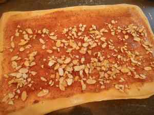 Here you can see I left a good 1/2 inch edge all around. Then I brushed on some water  - it helps to keep the seam together once you roll it up. 