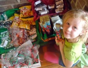 A girl and her candy are not soon parted at Wright Square Cafe.
