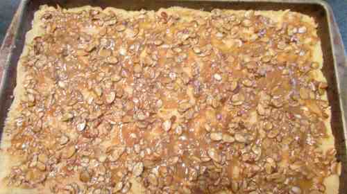 Spread the topping on the crust and it's oven-ready.