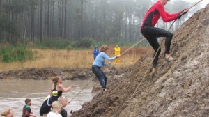 After wading through a muddy pool of frigid water it's up a 20-foot "mountain".