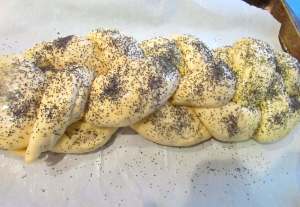 Preheat your oven, brush more glaze on the risen bread and sprinkle with poppy seeds, if you like.