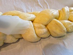 Brush on the glaze and allow to rise again for about an hour.