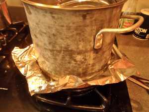 Cover with oiled foil and a very heavy oven proof pot. 