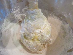 Add in the dry ingredients. The KitchenAid mixer makes quick work of it. Mix it together well and then knead for a couple of minutes by hand if you like.