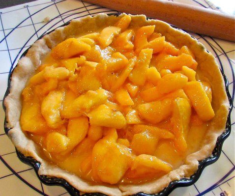 Pour the peaches into the pie shell and ...