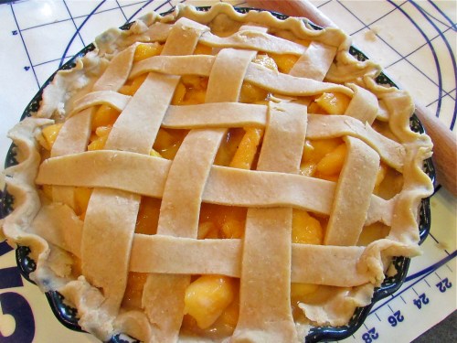 Add the top pie crust . I like a lattice crust peach pies - so pretty and allows me to better gauge when the pie is ready to come out of the oven.