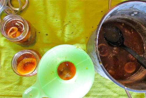Have all jars, lids and rings washed and sanitized (I hold prewashed jars and lids in a pot of simmering hot water). This is my typical setup - love the wide mouth funnel. Helps reduce the messiness, a little anyway!